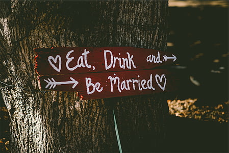 signage leaning on tree thumbnail