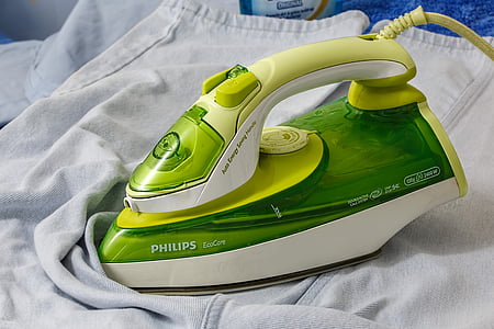green and white Philips EcoCare clothes iron on white textile thumbnail