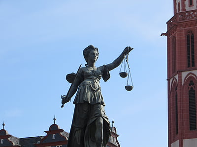 woman holder sword statue at daytime thumbnail