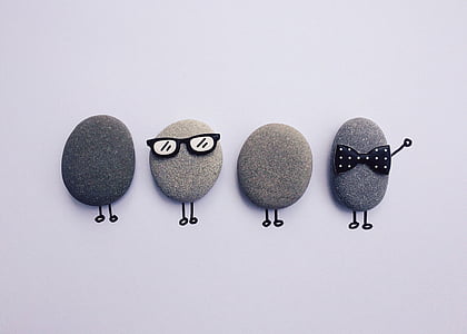 high-angle photography of four decorated stones thumbnail