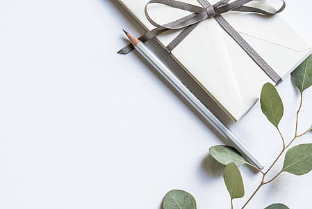 gray pencil beside white gift box thumbnail
