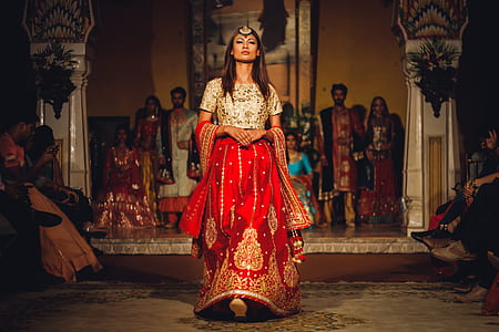 woman wearing red and brown dress thumbnail