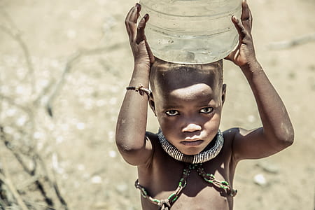 boy carrying plastic carboy thumbnail