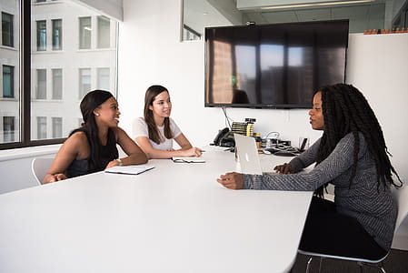 Group of Women Sitting on Chairs thumbnail