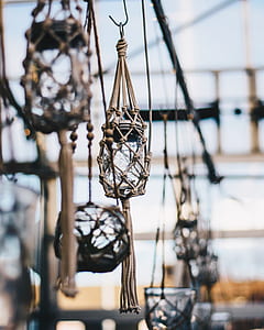 clear glass mason jar with brown net hang shallow focus photography thumbnail