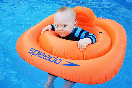 baby on orange Speedo floater thumbnail