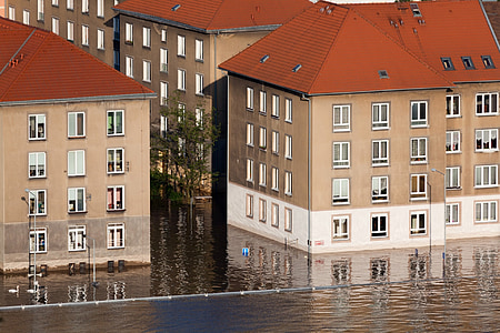 concrete building beside body of water at daytime thumbnail