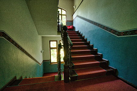 brown wooden stairs inside house thumbnail