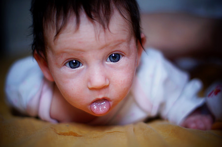 baby's lying on bed thumbnail