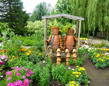 human-themed plant pot decor on shelf thumbnail