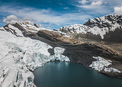 body of water surrounded by rock formation thumbnail