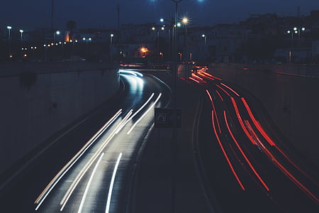 time lapse photography of car on road thumbnail