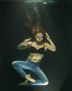 woman floating on body of water thumbnail