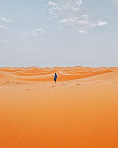 person standing on desert thumbnail
