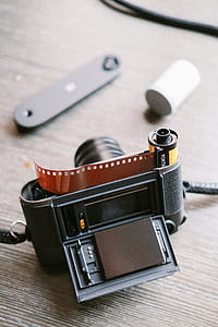 black camera on top of brown board thumbnail