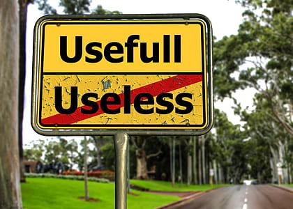 yellow and black usefull and useless road sign thumbnail