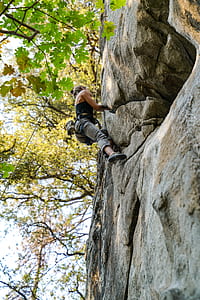 woman rock climbing during daytime thumbnail