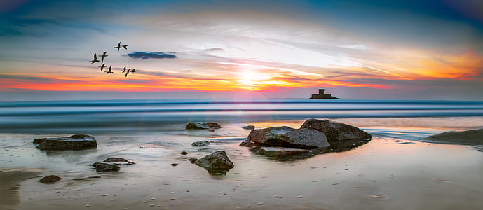 Sea Rocks Surrounded by Body of Water High-saturated Photography thumbnail