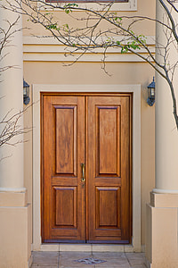 closed brown wooden door thumbnail