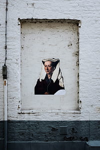 white concrete wall with woman's profile painting thumbnail