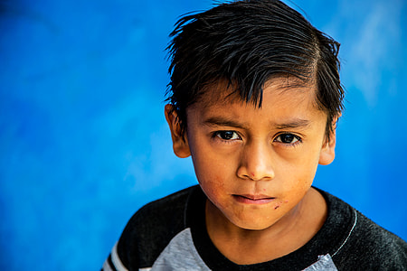 close-up photo of boy in gray and black top thumbnail