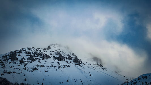 Snow Covered Mountain Under Cloudy Blue Sky thumbnail