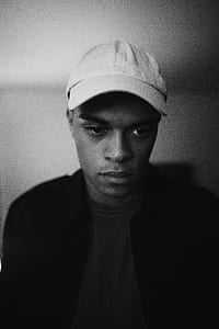 grayscale shot of man wearing jacket thumbnail