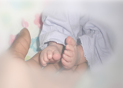 person holding baby's feet thumbnail