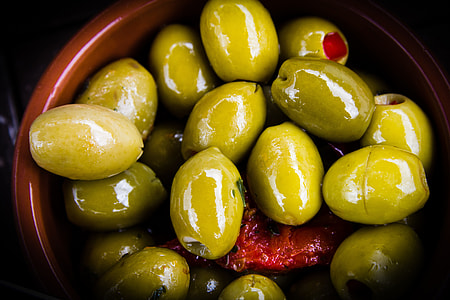 green olives on round brown bowl thumbnail