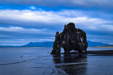 gray rock formation above the sea thumbnail
