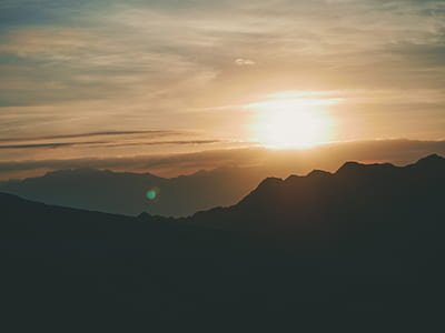 silhouette on mountain during golden hour thumbnail