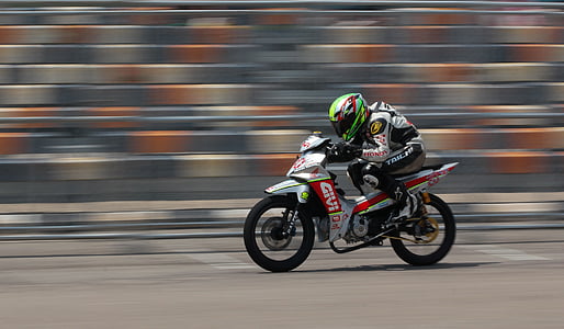 panning photography of rider thumbnail