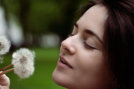 shallow focus photography of woman's face thumbnail