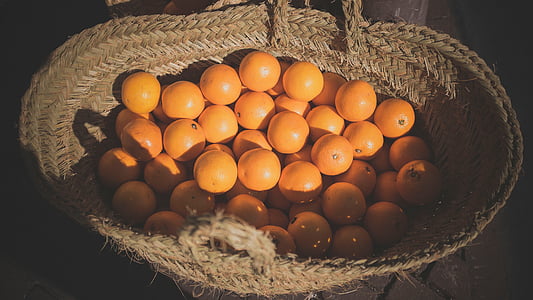 bunch of oranges in wicker basket thumbnail