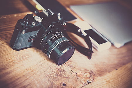 black bridge camera beside phone thumbnail