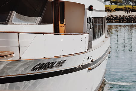 white Caroline boat on body of water thumbnail