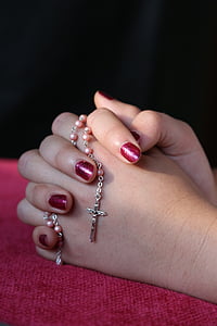 person holding rosary thumbnail