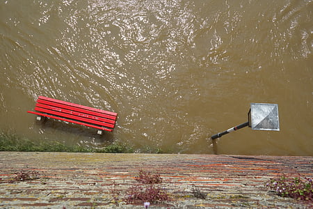red bench chair drowned with water thumbnail