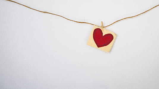 photo of paper with heart drawing hanged on wall thumbnail