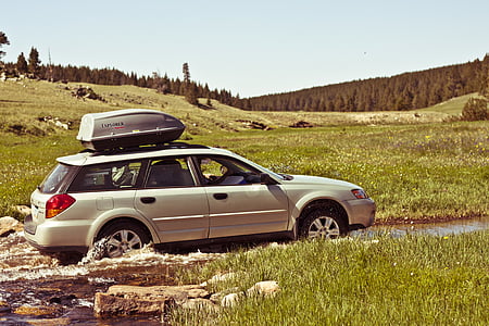 white station wagon on dirt road during daytime thumbnail