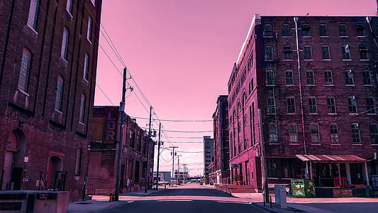 asphalt road between buildings thumbnail