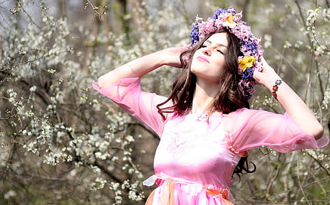 woman in pink traditional dress wearing tiara thumbnail