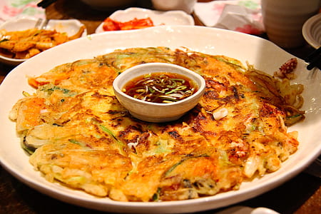 fried food with sauce on plate thumbnail