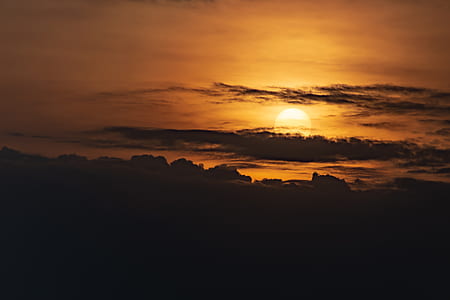 silhouette of clouds at golden hour thumbnail