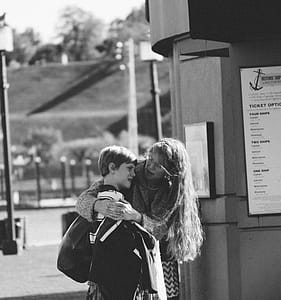 Woman Holding Boy Gray Scale Shot thumbnail