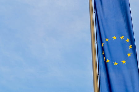 yellow star blue flag under blue sky thumbnail