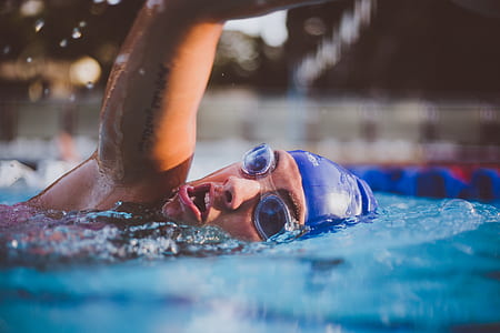 person swimming on blue pool thumbnail