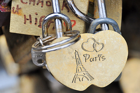 selective focus photography of beige Paris engraved heart lock with keys thumbnail