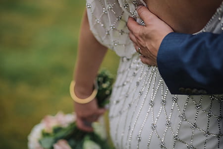 person holding back body part thumbnail