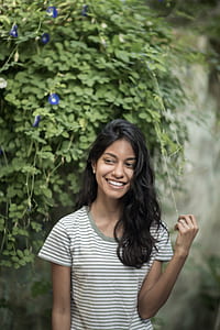 selective focus photography of woman wearing white and black striped t-shirt thumbnail